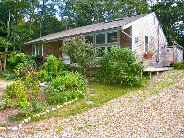 a front view of a house with garden