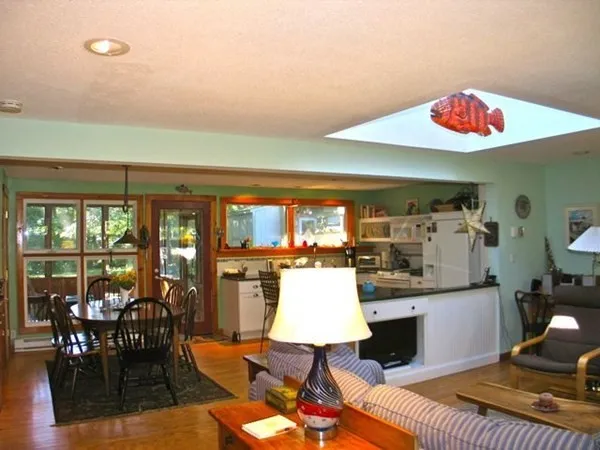 a kitchen with stainless steel appliances granite countertop a sink and a stove