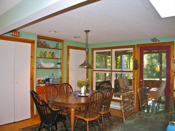 100 Franklin Avenue Tisbury, MA 02568 - Photo 9 of 18 a view of a dining room with furniture window and outside view