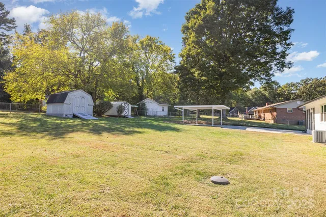 a house view with swimming pool in front of it