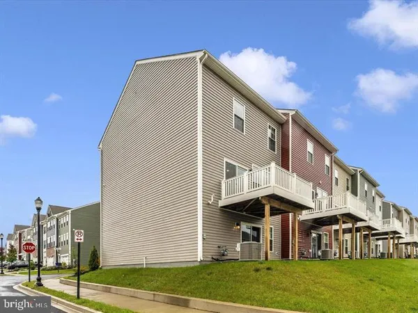 a view of a big house with a yard