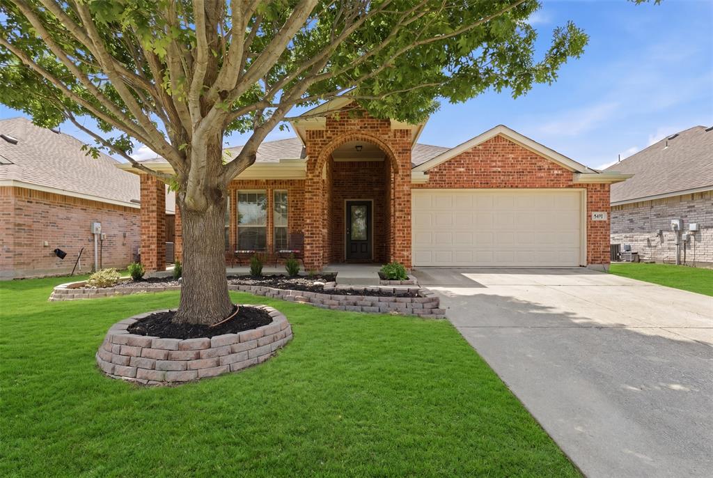 5491 Exeter Drive Prosper, TX 75078 - Photo 1 of 20 a front view of a house with a yard