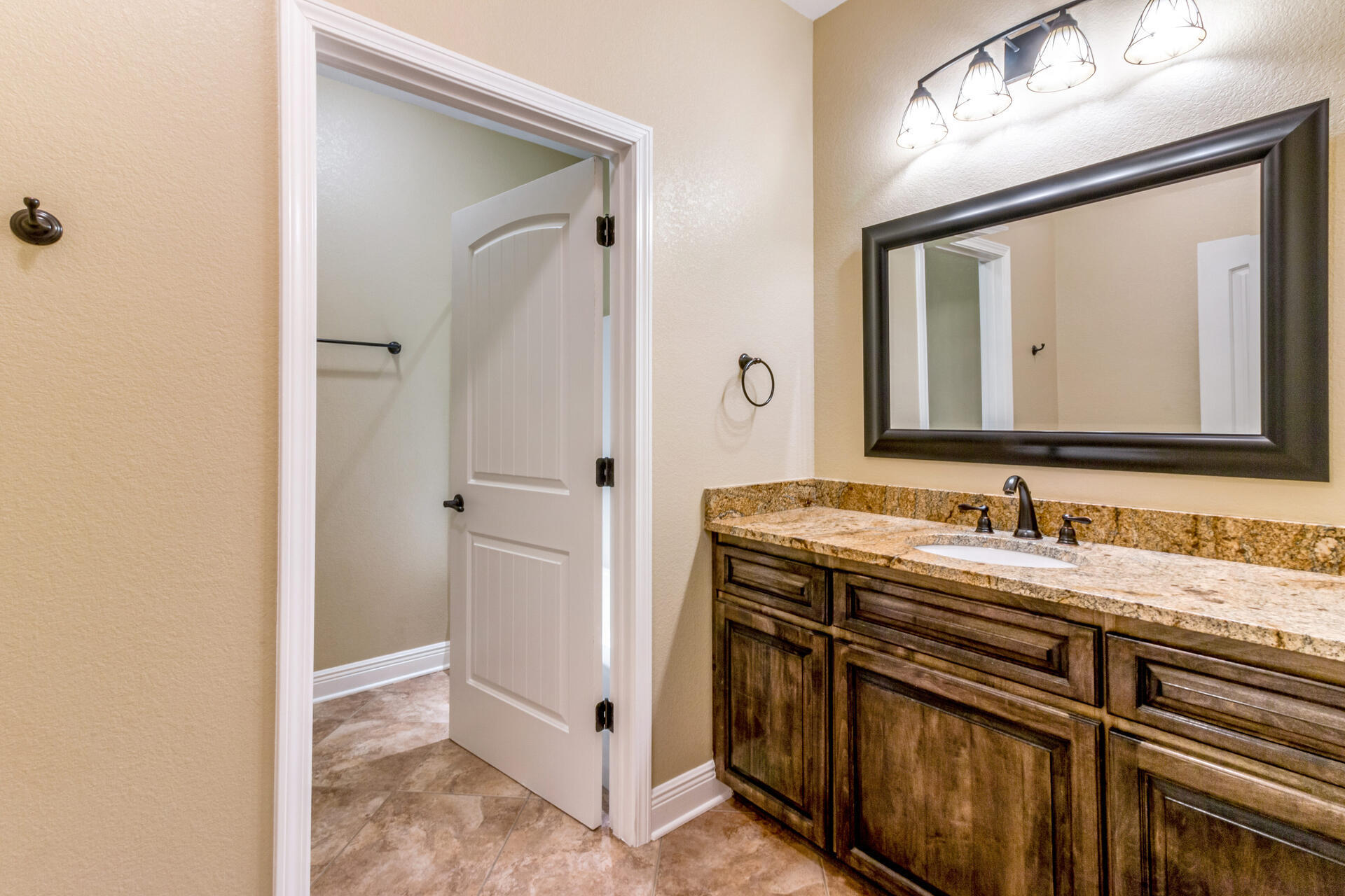 4091 Happy Trails Road Crestview, FL 32539 - Photo 23 of 41 a bathroom with a double vanity sink mirror and