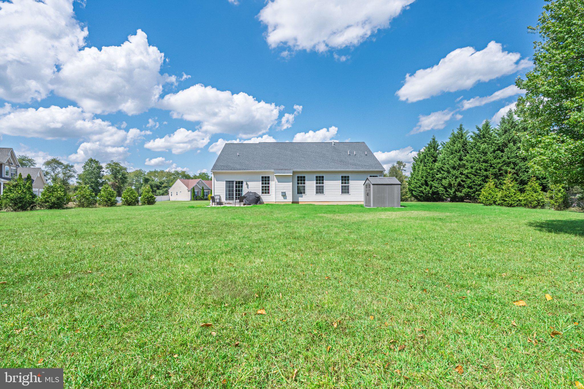 1092 Chews Landing Road Clementon, NJ 08021 - Photo 35 of 41 Spacious yard under a bright sky.