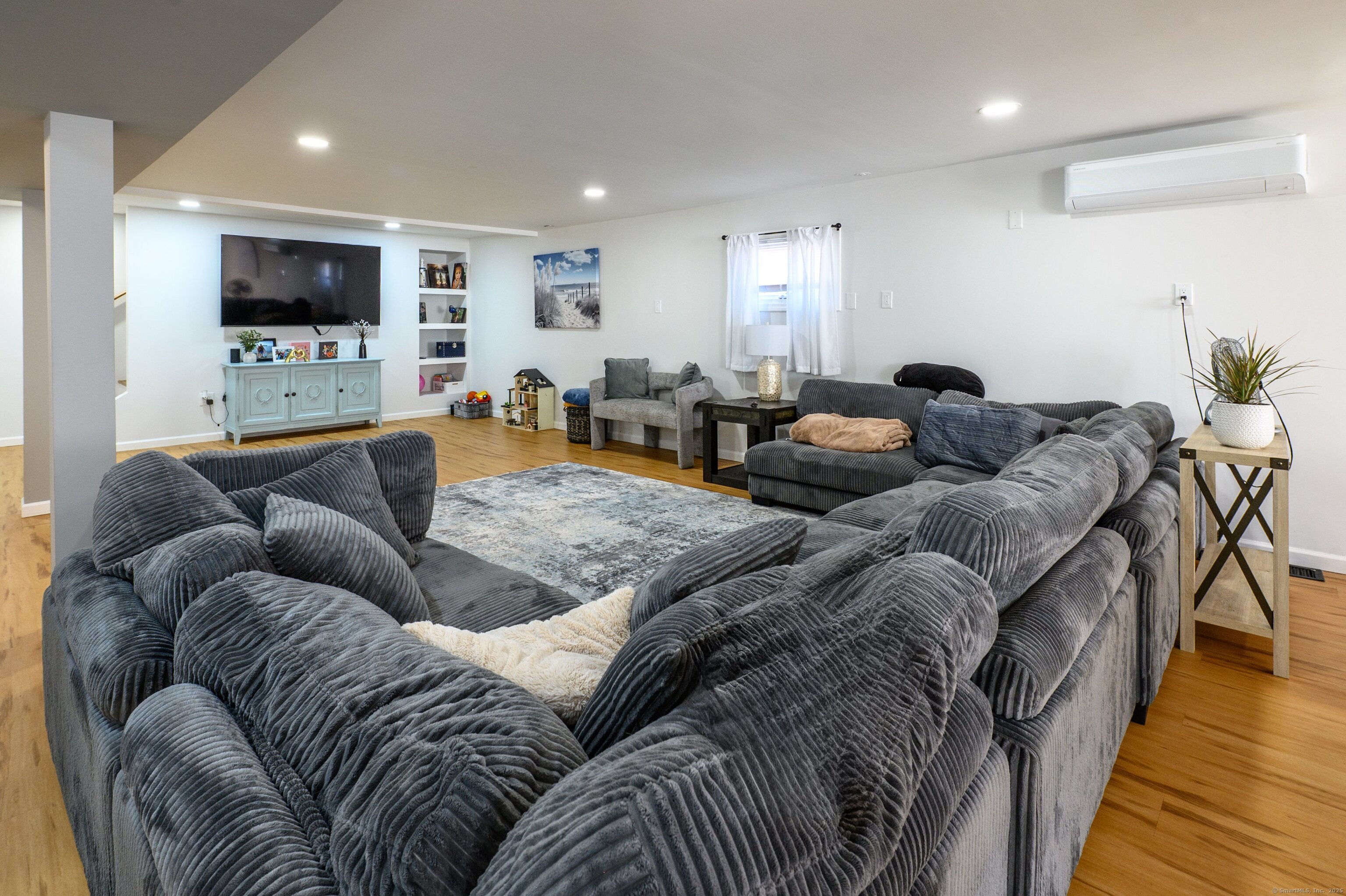 Beach Road Old Saybrook, CT 06475 - Photo 11 of 16 a living room with furniture and a flat screen tv