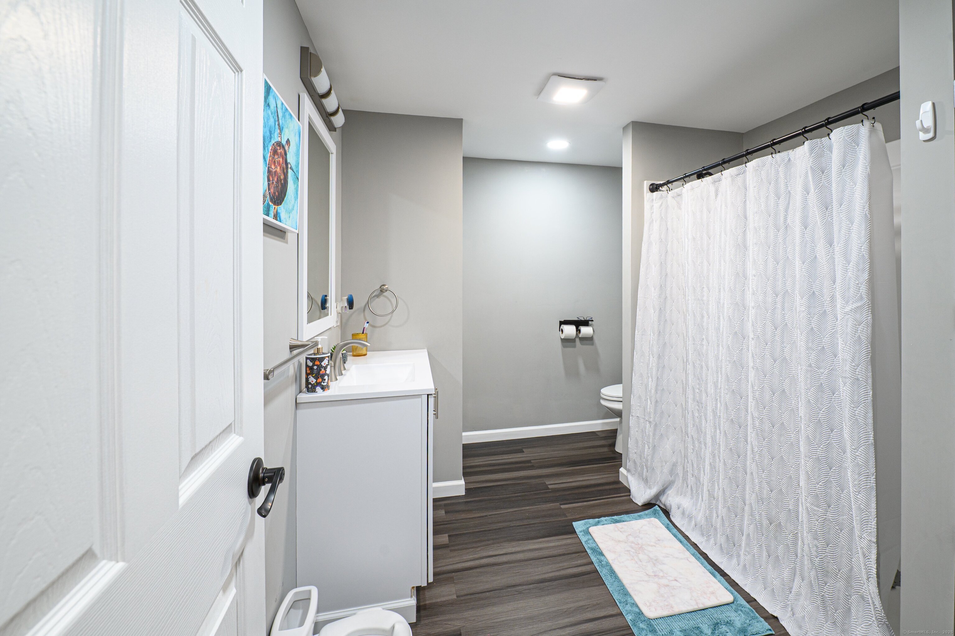 Beach Road Old Saybrook, CT 06475 - Photo 12 of 16 a bathroom with a sink a toilet and shower