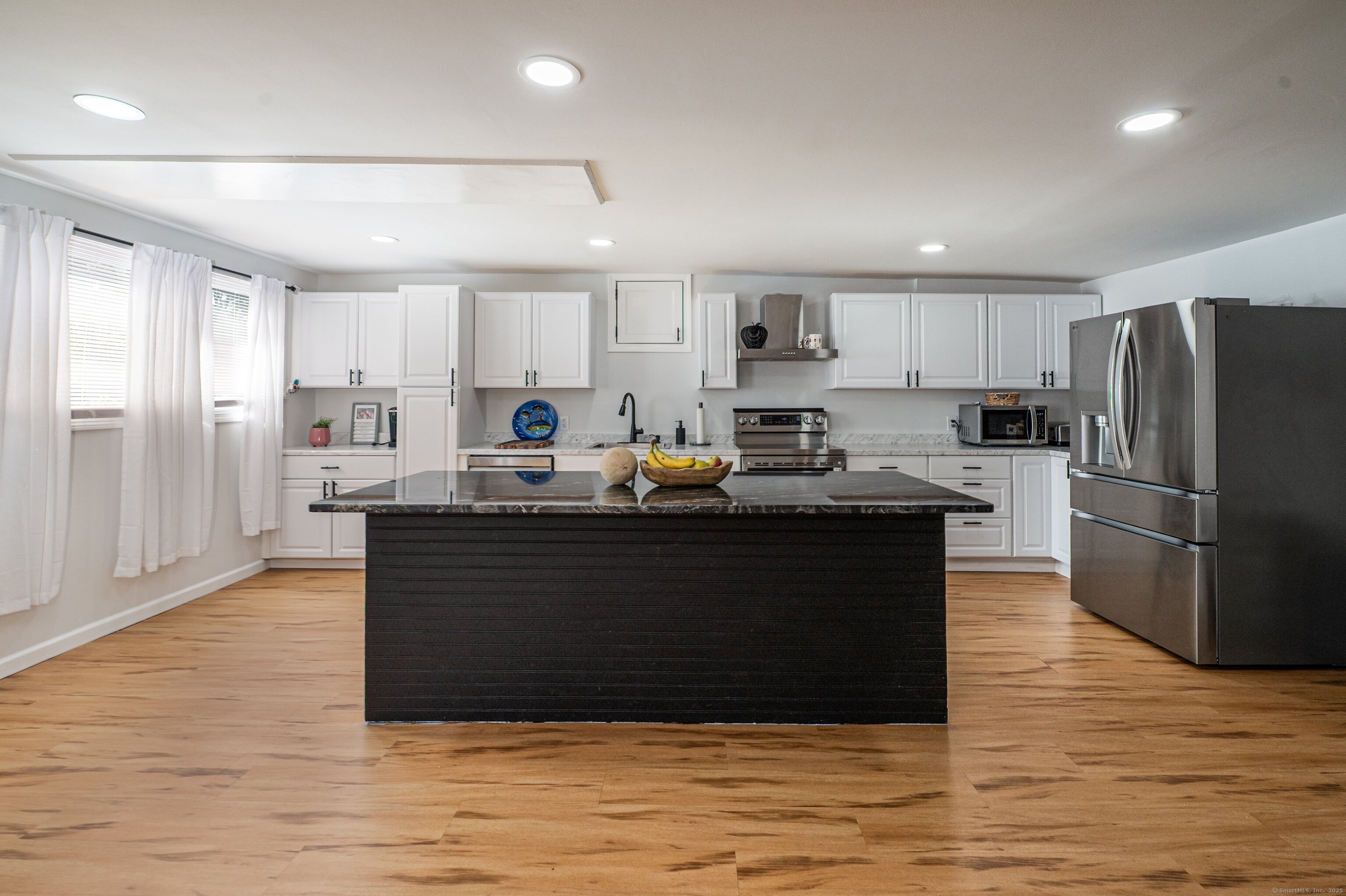 Beach Road Old Saybrook, CT 06475 - Photo 13 of 16 a kitchen with a refrigerator and a stove top oven