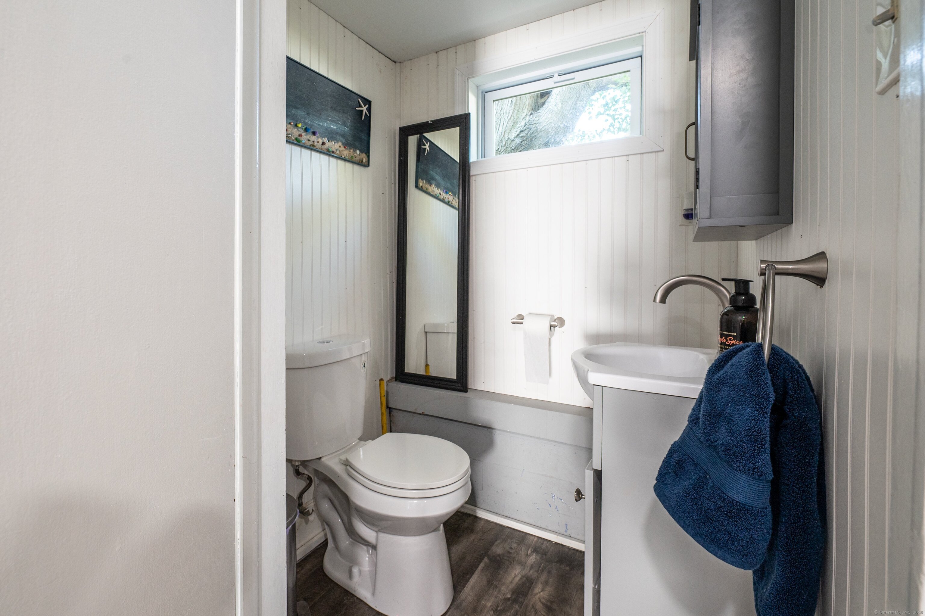 Beach Road Old Saybrook, CT 06475 - Photo 9 of 16 a bathroom with a toilet and a sink