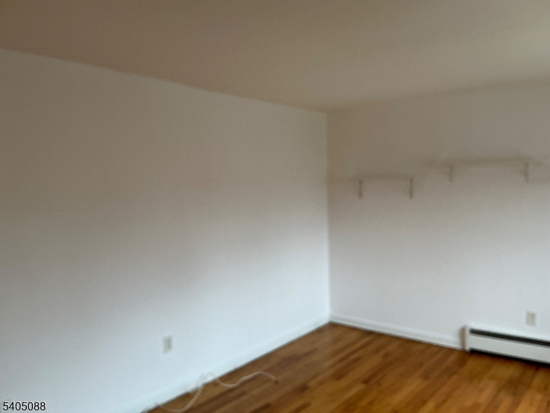 6 Colonial Drive, Unit A Little Falls, NJ 07424 - Photo 5 of 7 a view of a room with wooden floor
