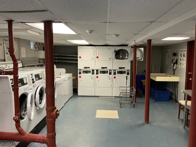 a view of a kitchen with appliances and a large window