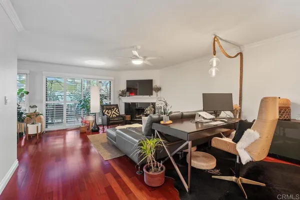 a living room with furniture fireplace and a flat screen tv