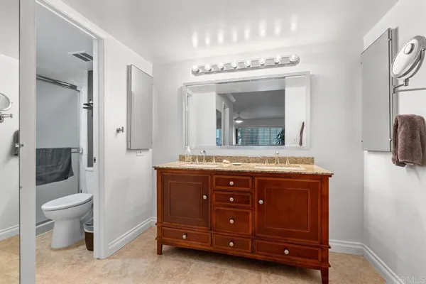 an aerial view of multiple houses with a street