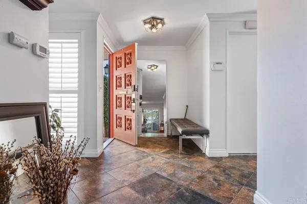 a view of entryway and hall with dining room