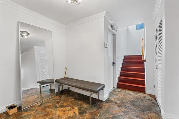 a bathroom with a granite countertop sink and a mirror with toilet
