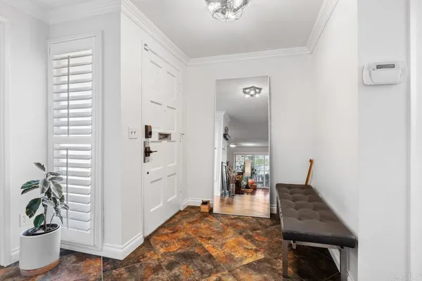 a workspace with furniture wooden floor and a window