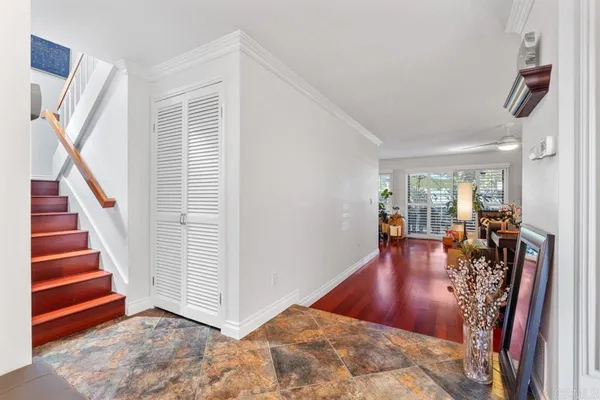 a view of a dining room with furniture and wooden floor