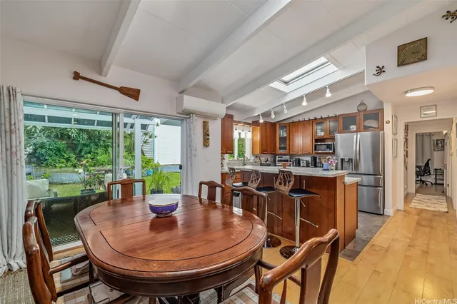 a view of a dining room with furniture window and outside view