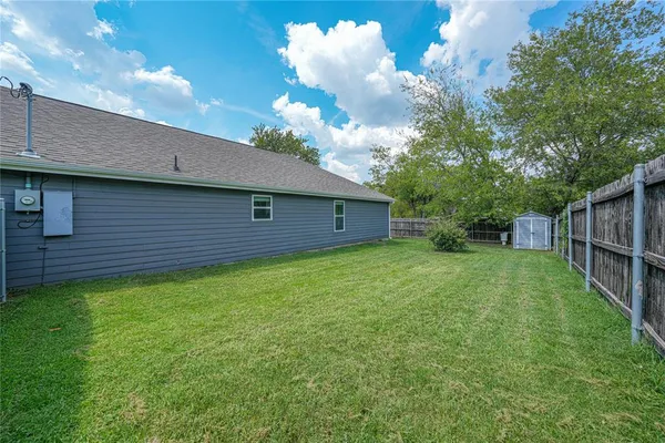 a backyard of a house with lots of green space