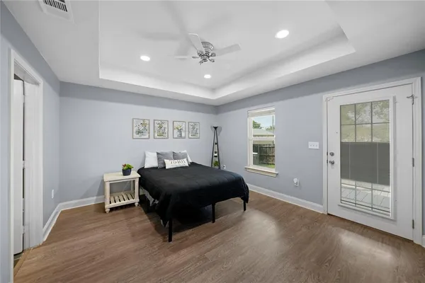 a living room with a bed furniture and a window