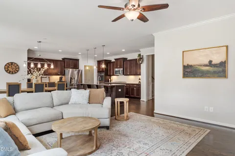 a living room with furniture and kitchen view