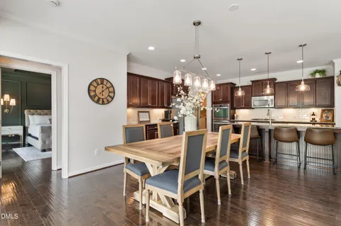a view of a dining area with furniture and wooden floor