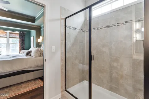a en suite bathroom with a granite countertop shower and a bathtub