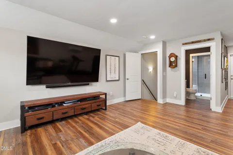 a living room with a flat screen tv and a couch