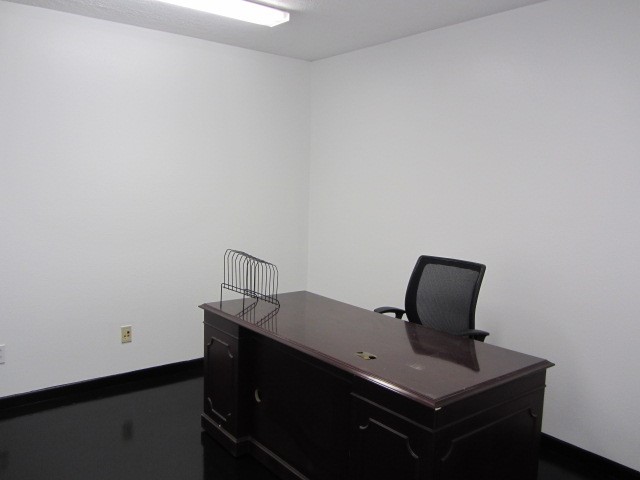 228 Farm To Market Road 3478 Huntsville, TX 77320 - Photo 13 of 28 a view of workspace with wooden wall