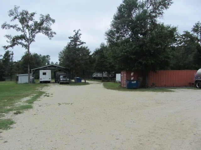 a view of outdoor space with deck and yard