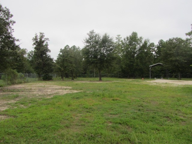 228 Farm To Market Road 3478 Huntsville, TX 77320 - Photo 21 of 28 a view of outdoor space with deck and yard