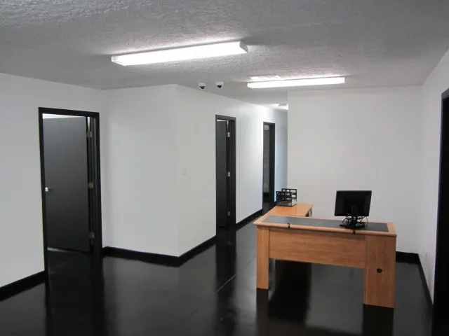 a view of kitchen with a refrigerator
