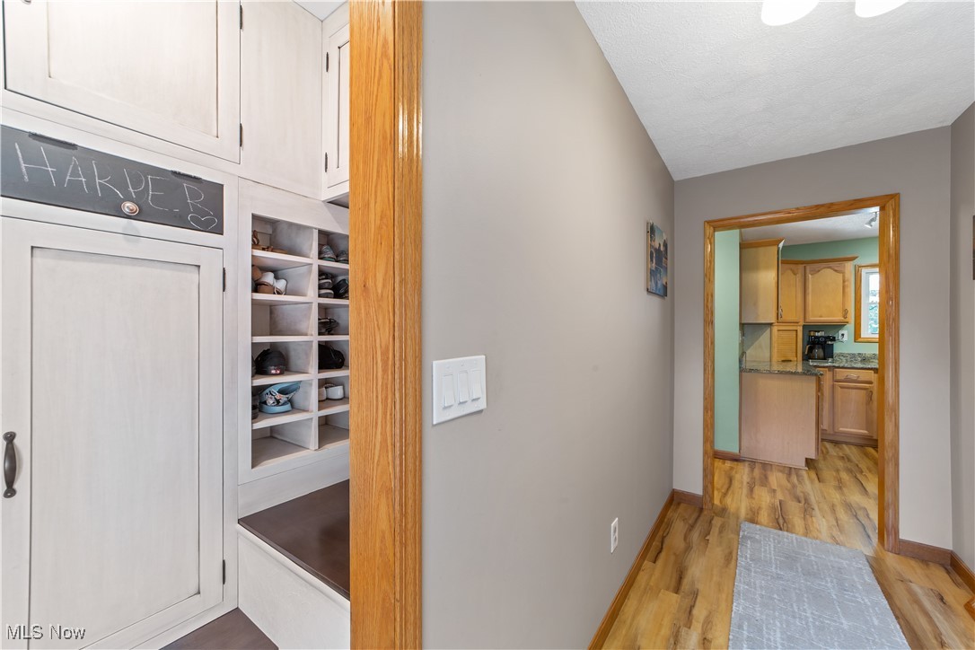 3694 Nichols Road Medina, OH 44256 - Photo 2 of 47 Hall featuring light wood finished floors and a textured ceiling