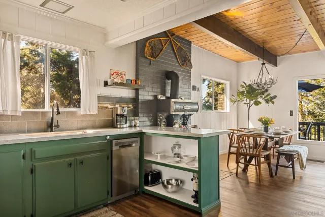 a kitchen with sink and cabinets