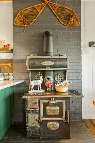 a bathroom with a stove and cabinets