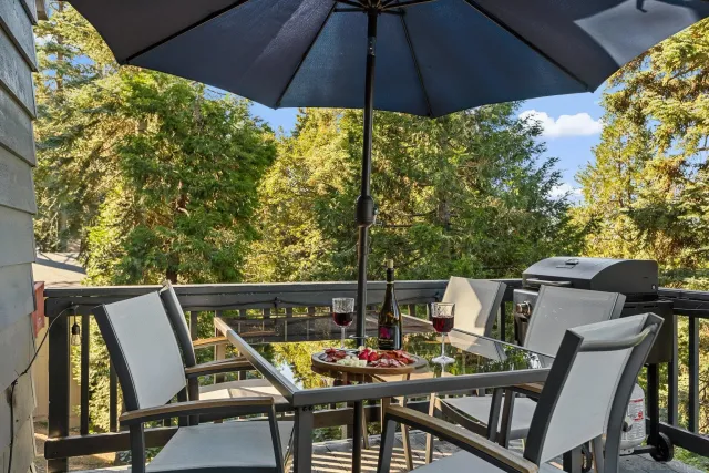 a patio with furniture and umbrella