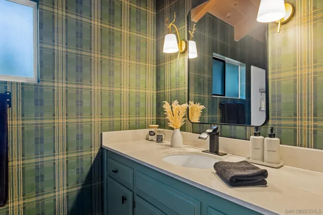 a bathroom with a sink and a mirror