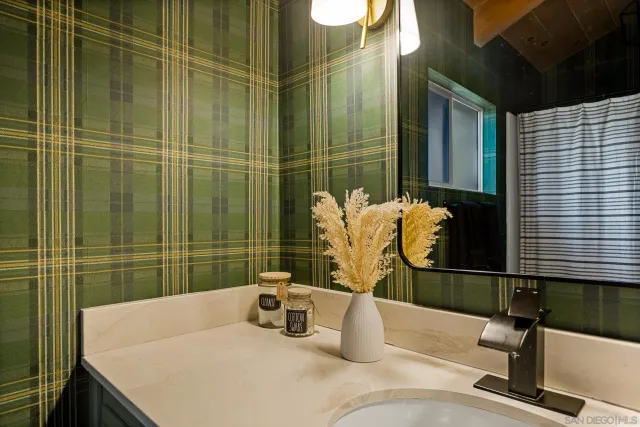 a bathroom with a sink and a mirror