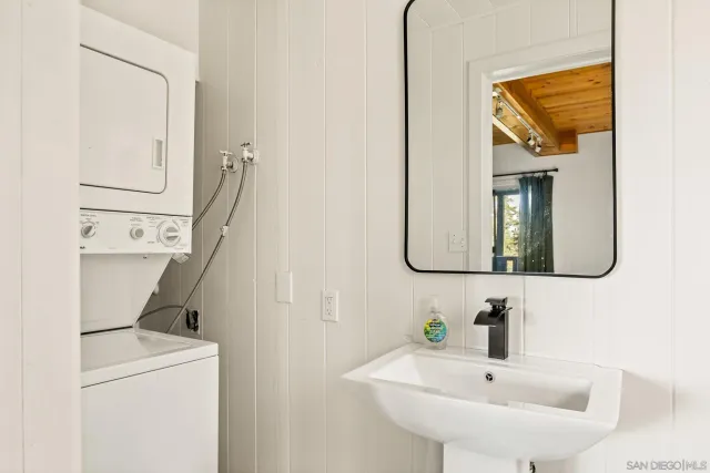 a bathroom with a sink and mirror