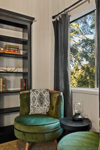 a view of a living room with furniture and a window