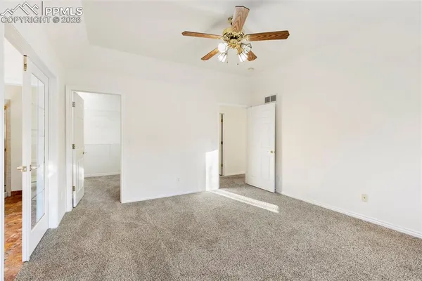 a bathroom with a shower and a toilet