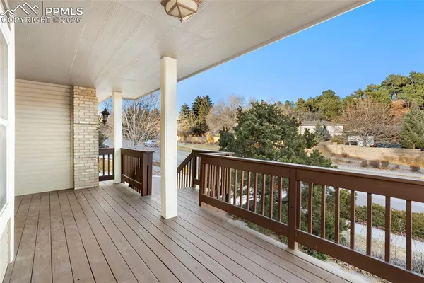 a view of a balcony with wooden floor
