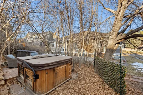 a view of a patio with iron fence