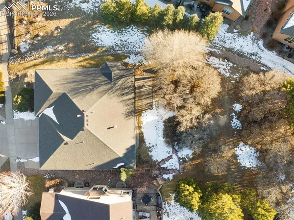 an aerial view of residential houses with outdoor space