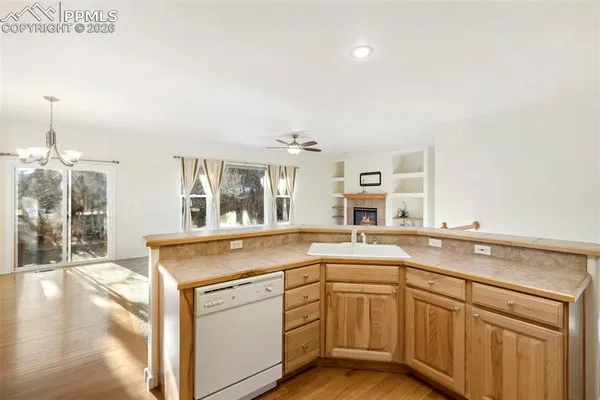 a kitchen with a sink and cabinets