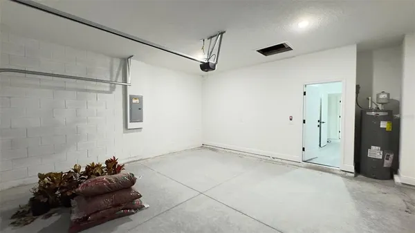 a room with gym equipment and a chandelier