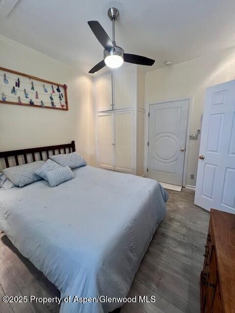 337 West Avenue Rifle, CO 81650 - Photo 14 of 29 a bedroom with a bed and a ceiling fan