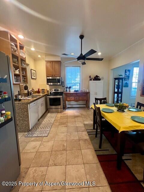 337 West Avenue Rifle, CO 81650 - Photo 15 of 29 a kitchen with stainless steel appliances kitchen island granite countertop a sink and a refrigerator