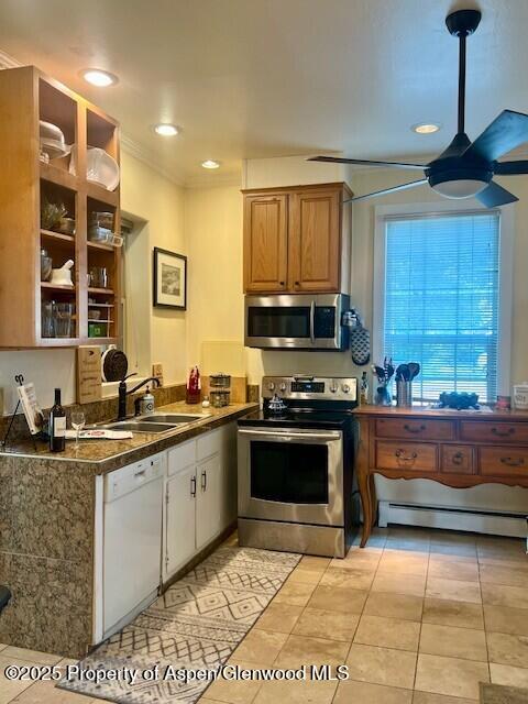 337 West Avenue Rifle, CO 81650 - Photo 16 of 29 a kitchen with stainless steel appliances granite countertop a stove a sink and a microwave