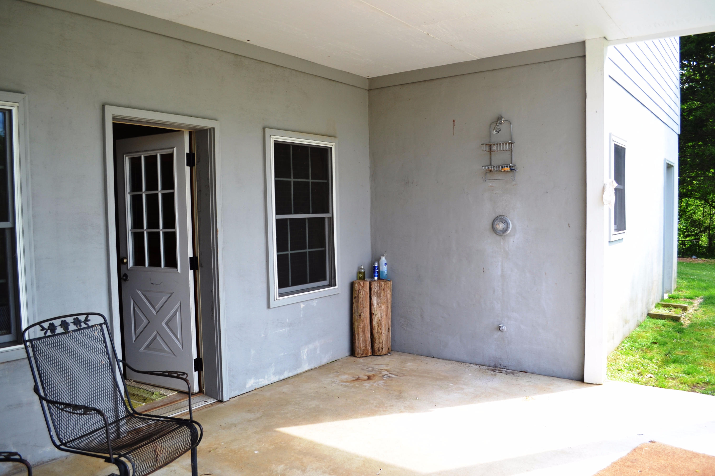 625 New England Road Wildwood, GA 30757 - Photo 29 of 59 Lower level outside shower and patio