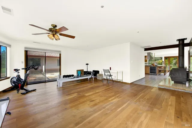 a kitchen with stainless steel appliances granite countertop a refrigerator and a stove